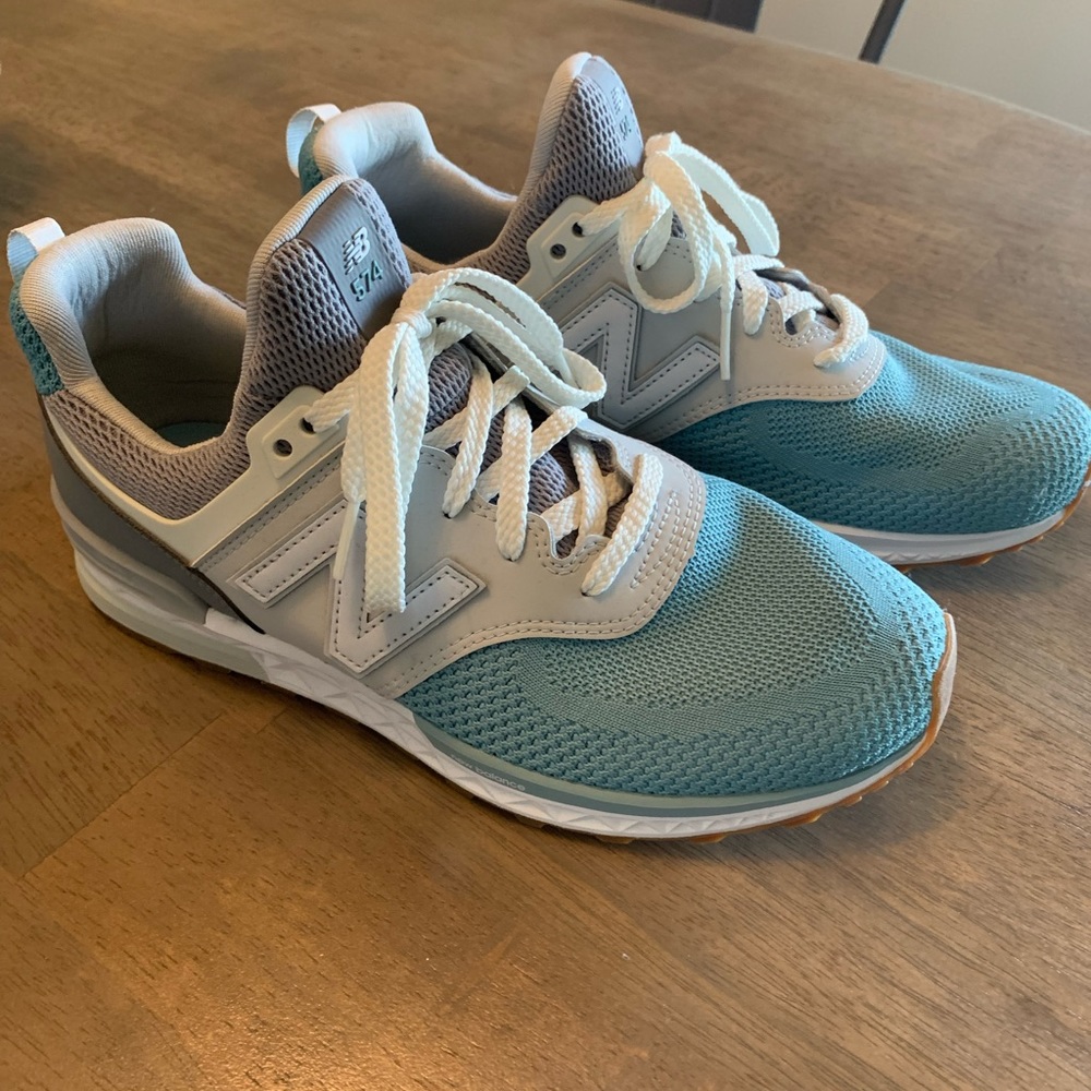 New Balance 574. Size 7Y fits like a women’s 8.5.